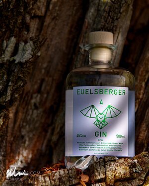 Bottle of Euelsberger Gin 500ml 45% vol with wooden cork on tree bark background