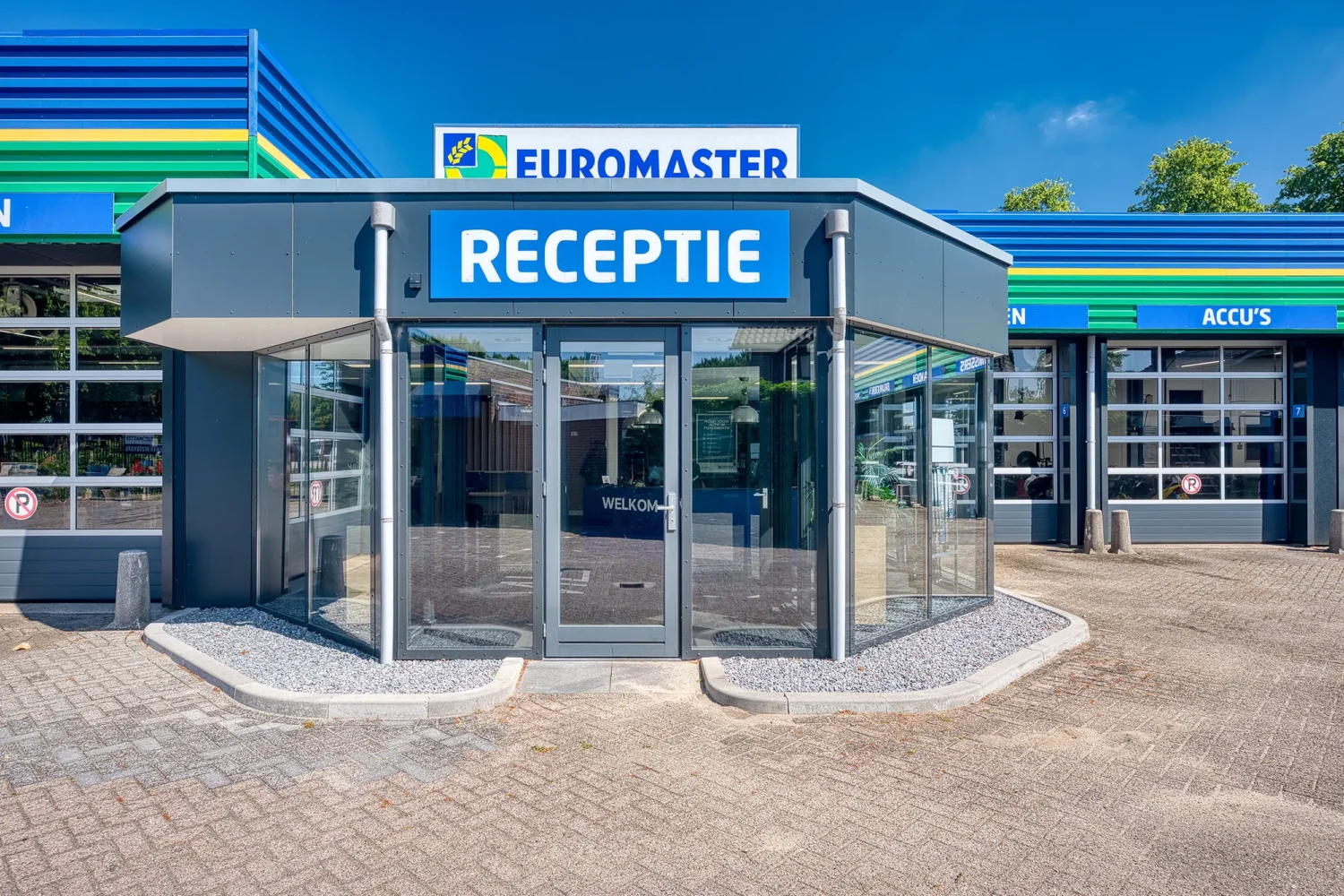 Professional exterior photography of a dealership reception entrance for a multi-location commercial project.