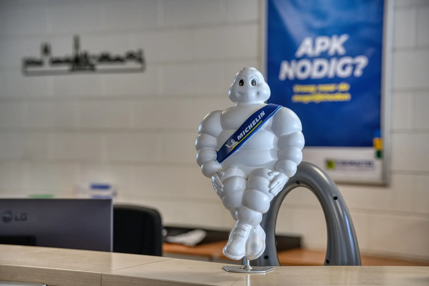 Professional detail photography featuring branded customer reception elements in an automotive service centre.